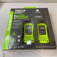 Box packaging of Motorola T600 H2O two-way radios, showing product details and features