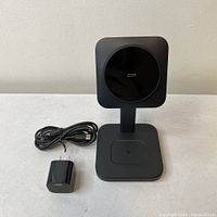 Front view of ESR Qi23 charging dock with USB-C cable and power adapter laid out separately.