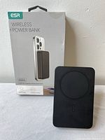 ESR branded wireless power bank in black with packaging box behind it, showing MagSafe compatibility and product image.