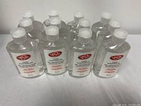 12 bottles of Lifebuoy Hand Sanitizer Gel arranged on a surface.