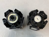 Photo of the two LED garage lights showing the back sides, revealing the LED chip arrays and circuitry.