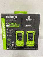 Front packaging showing two green Motorola T600 H2O radios in box with branding and key features