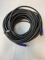 Coiled 40 foot HDMI cable with black rubber insulation, showing overall length and thickness.