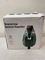 Front view of product box showing device image, IP45 waterproof rating, and solar powered feature.