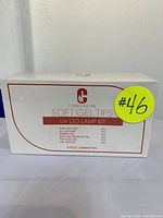 Front of box showing Clara Colors Soft Gel Tips UV LED Lamp Kit with item count and part list.