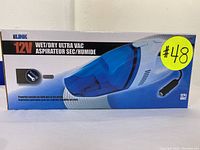 Front of box showing iLink 12V Wet/Dry Ultra Vacuum with image of vacuum, voltage and features stated.