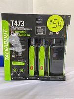 Front of retail box showing 3 Motorola T473 two-way radios, 2 year warranty, NOAA weather alerts, 56 km range claim.