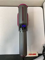 Front view of the portable garment steamer showing the digital display and handle.