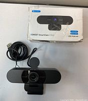 Smartcam C960 USB Webcam in front of original box showing brand and product details.
