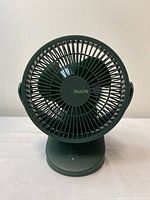 Front view of the Jisulife clip fan showing fan blades and brand name.