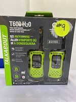 Front of the box showing two green Motorola T600 H2O radios visible through clear plastic window, with key features and branding on the box front.