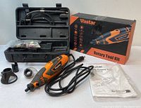 Full kit displayed including rotary tool, case with accessories, box, and instruction manuals