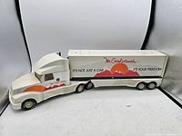Side view of vintage Nylint 18 wheeler toy truck showing trailer signage with "Mr. Goodwrench" branding and slogan