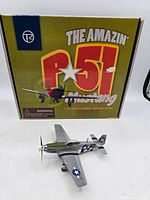 Box featuring 'The Amazin' P-51 Mustang' with image of plane and warning label.