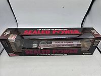 Front view of the Racing Champions Sealed Power 1:24 scale diecast dragster in original packaging showing branding and model details.