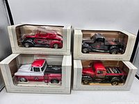 Four Spec Cast 1:24 scale diecast vintage pickup truck collector banks in original boxes, showing different colors and decals.