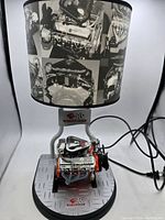 Side view of the 427 big block motor engine lamp showing the base plate with 427 emblem and lampshade with automotive engine photos.