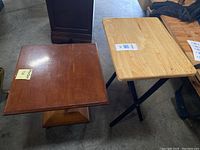 Photo showing the reddish-brown end table next to the light natural wood TV tray highlighting different finishes and styles.