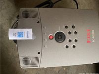 Top view of Eiki LC-XG210 projector showing control buttons and model branding.