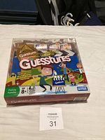 Box front of Guesstures board game, showing colorful artwork and branding