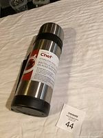 Front view showing brand label and bottle features.