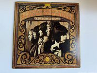 Full front cover of vintage Buffalo Springfield album 'Last Time Around' showing the band members and ornate design.