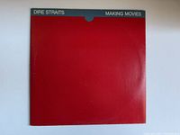 Front side of the vinyl album sleeve showing red cover with green bands and Dire Straits Making Movies text.