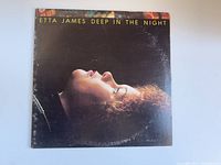 Front cover of the vinyl album showing Etta James' profile against a black background with worn edges.