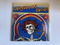 Front cover of the Grateful Dead album featuring skeleton with roses artwork