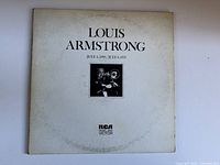 Front cover of vintage Louis Armstrong vinyl album showing title, photo of Louis Armstrong playing trumpet, RCA Victor logo, and catalog number VPM-6044 Mono.