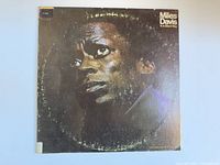 Front cover photo of 'Miles Davis In A Silent Way' vintage vinyl record album showing a close-up portrait of Miles Davis with wear on cover.