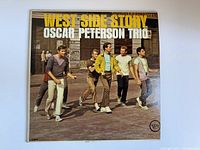 Front cover of the vinyl album "West Side Story" by the Oscar Peterson Trio, showing five men walking on a street with the title in large yellow and white text.