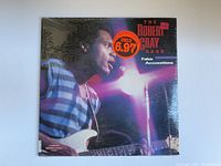 Front cover of sealed Robert Cray Band 'False Accusations' album showing artist playing guitar with retail price sticker.