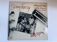 Front cover of vinyl album showing the title 'Sonny Terry Whoopin' with photo of artists and harmonica image.