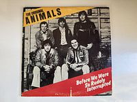 Front of the vinyl album cover featuring the band members and title.