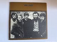Front album cover showing band photo and title.
