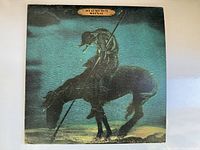 Front cover of vintage The Beach Boys vinyl album showing artwork of busting figure on horse with spear.