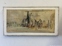 Frontal view of entire mixed media painting on board in white-painted wood frame