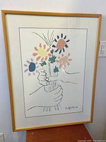 Full front view of framed print against white wall