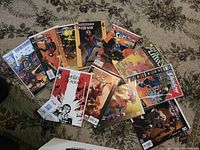 Image showing a variety of comic books including Spider-Man, Supergirl, Umbrella Academy