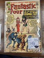 Front cover of Fantastic Four #19 comic. Shows the main art with Rama-Tut, the Thing, and Sue Storm. A note on the cover reads 'FF4 #19 1961 VG Complete Low Grade 1st App RAMA TUT Kang Variant'