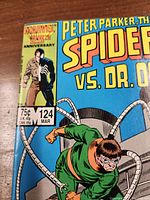 Front cover close-up of comic showing title, issue number 124, price 75c, and art of Spider-Man versus Dr. Octopus