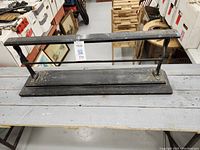 Top view of the full paper roller holder showing base and horizontal bar