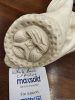 Close-up of carved man's face in parka hood