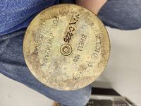 Base of WW2 brass shell showing stamped manufacturing and date markings.