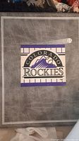 Vinny Castilla plaque with Colorado Rockies logo and baseball bat on gray background
