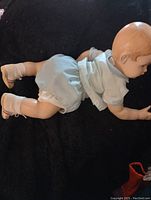 Mannequin lying on side showing back and outfit