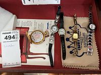 Overview of all five watches including one gold-tone Arnex pocket watch and four Brighton & Talbots wristwatches with various straps and metals.