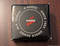 Top view of the original G-Shock black box with branding and model details