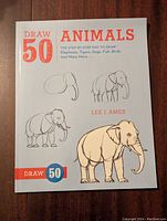 Front cover of the Draw 50 Animals step-by-step instruction book by Lee J. Ames showing stages of drawing an elephant.